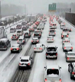 Southeast Shivers, Slides Under Winter Storm
