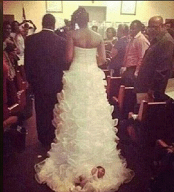 Bride Attaches Baby To Wedding Gown Train