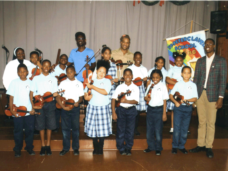 BLACK VIOLIN PERFORMS WITH ST. PETER CLAVER STUDENTS