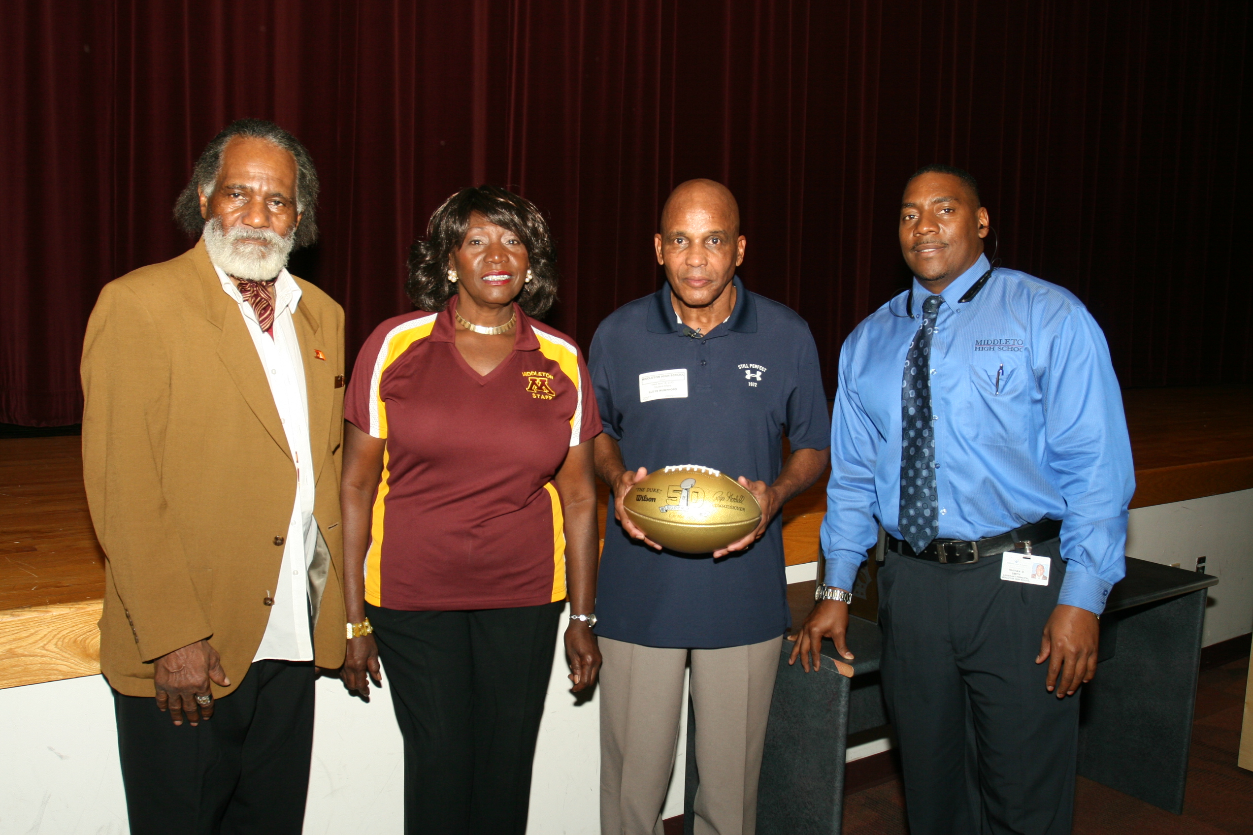 RETIRED NFL PLAYER PRESENTS GOLDEN FOOTBALL TO MIDDLETON HIGH SCHOOL