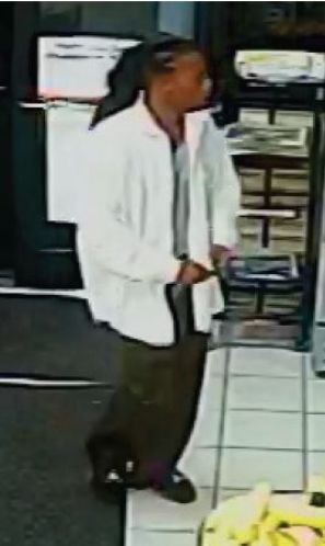Laughing Man Points Gun At Woman Pumping Gas