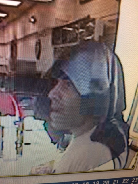 Man Stands In Line To Rob Store
