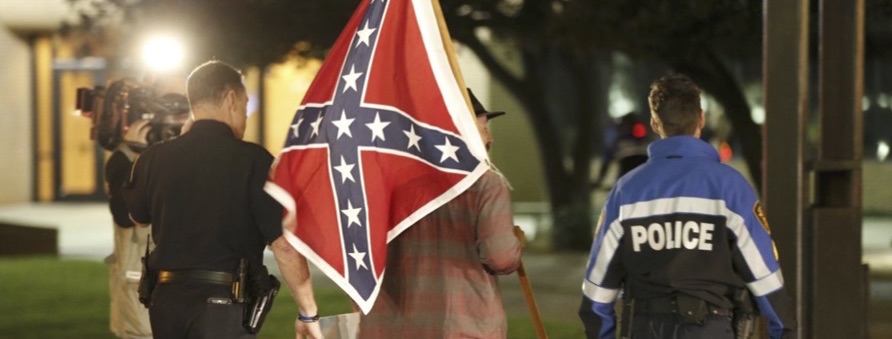 Michigan Police Officer Suspended After Driving Around Trump Protesters Waving  A Confederate Flag