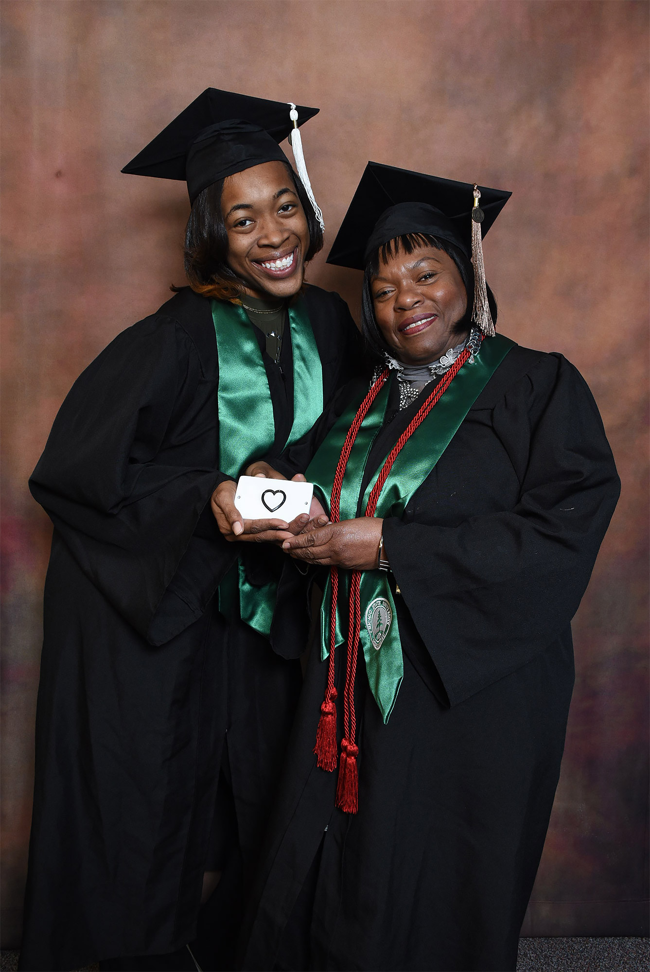 Grandmother And Granddaughter She Raised Graduate From College The Same Time