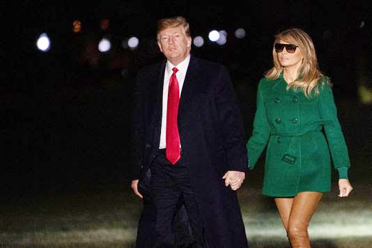 Donald Trump returns from Iraq, attacks Democrats over border wall and shutdown