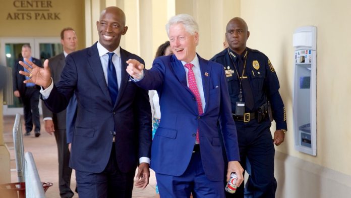 wayne-for-america-with-bill-clinton-696x392