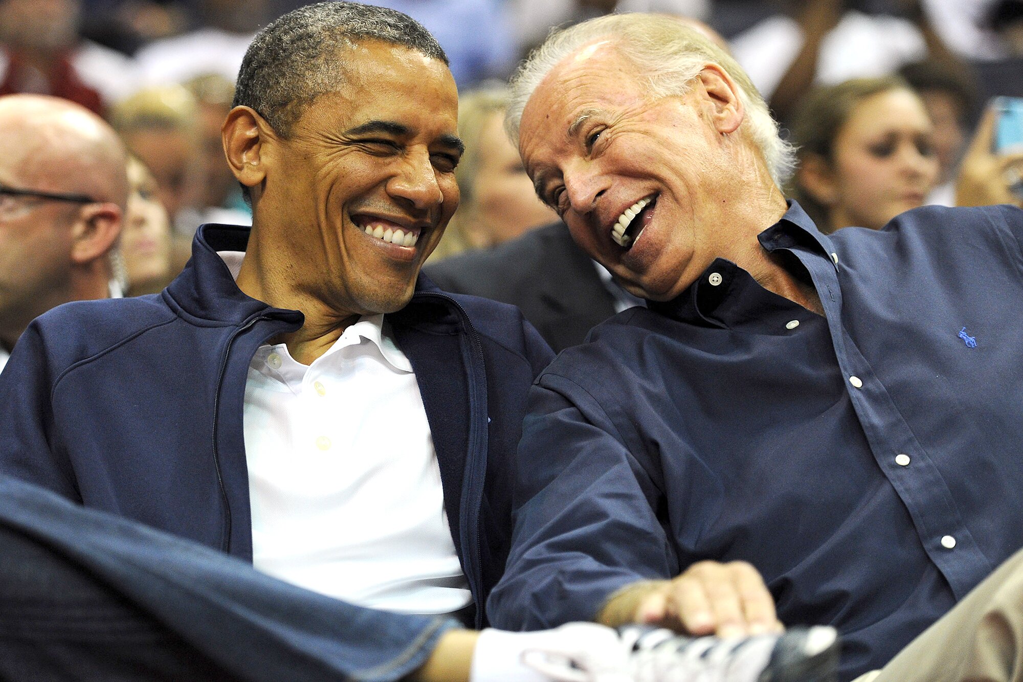 WASHINGTON, DC - JULY 16: U.S. President Barack Obama and Vice President Joe Biden share a laugh as the US Senior Men's National Team and Brazil play during a pre-Olympic exhibition basketball game at the Verizon Center on July 16, 2012 in Washington, DC. (Photo by Patrick Smith/Getty Images)
