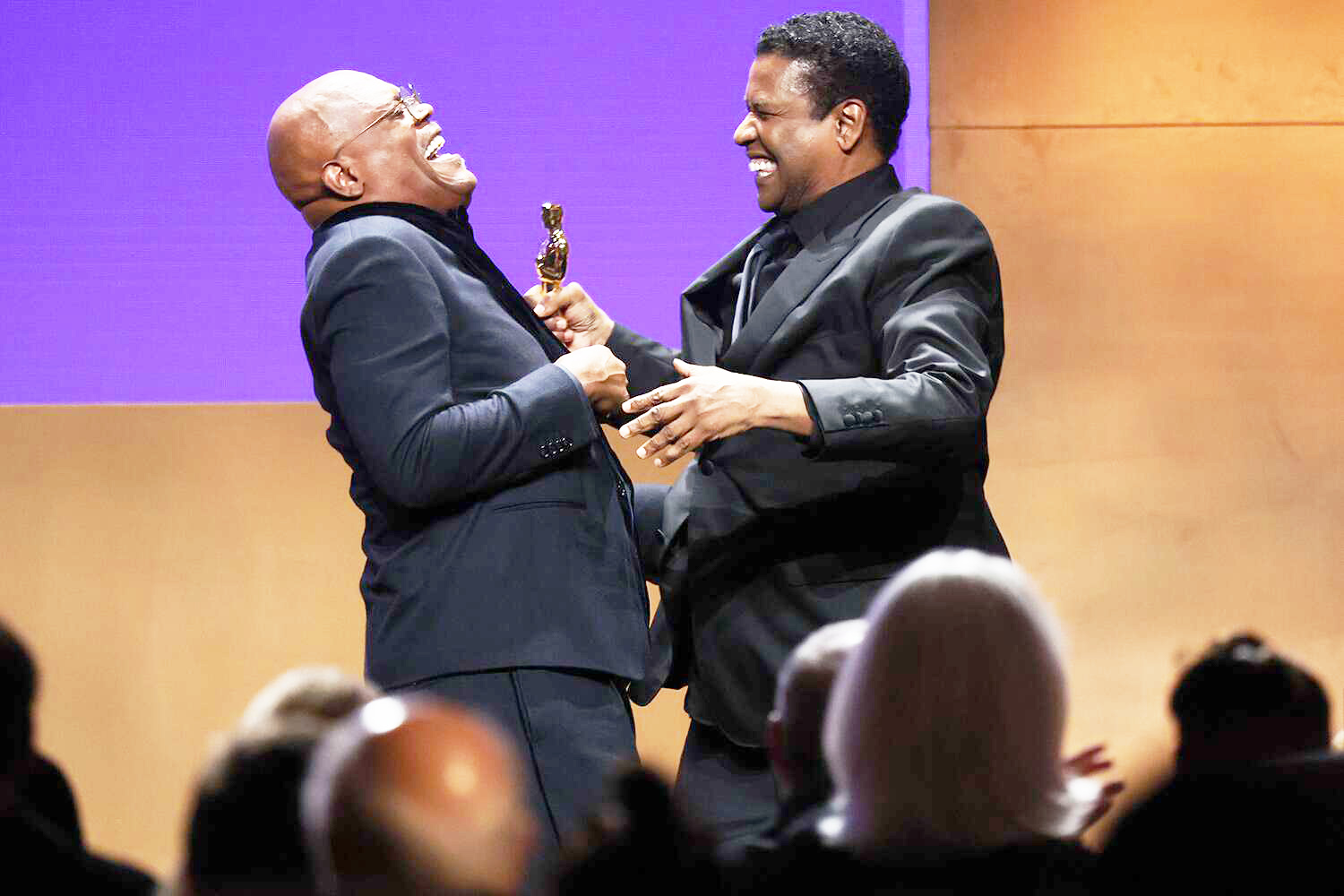 HOLLYWOOD, CALIFORNIA - MARCH 25: (L-R) Samuel L. Jackson and Denzel Washington speak onstage during the 2022 Governors Awards at The Ray Dolby Ballroom at Hollywood & Highland Center on March 25, 2022 in Hollywood, California. (Photo by Mike Coppola/Getty Images)