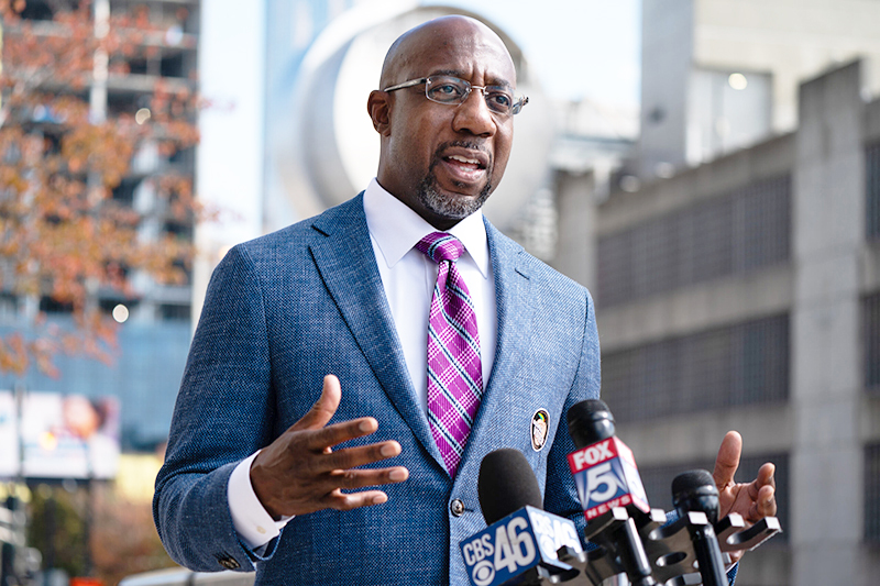 ATLANTA, GA - OCTOBER 21: Democratic U.S. senatorial candidate Raphael Warnock speaks to the media after casting his ballot at State Farm Arena on October 21, 2020 in Atlanta, Georgia. Warnock is hoping to unseat incumbent Kelly Loeffler. (Photo by Elijah Nouvelage/Getty Images)